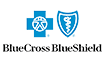 A blue cross and shield logo on a green background.